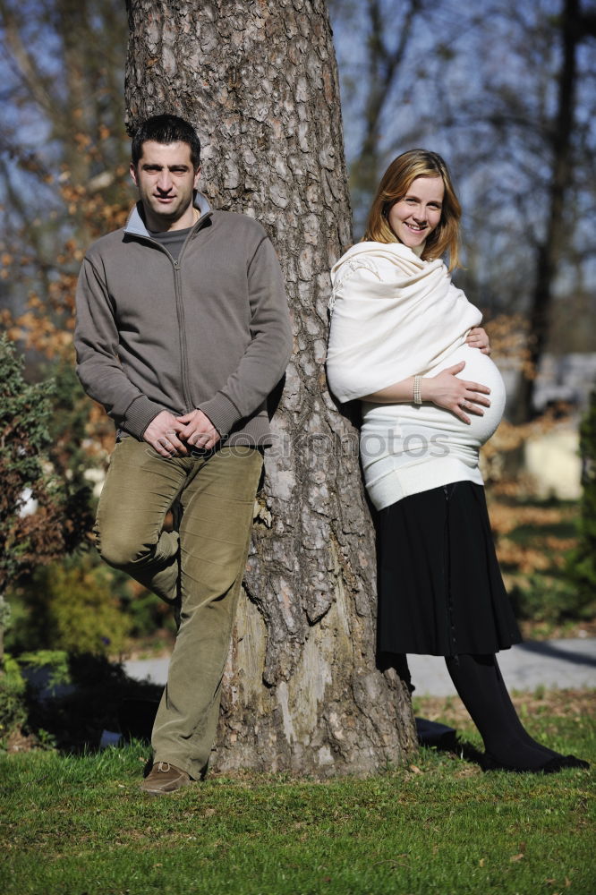 Similar – Image, Stock Photo young couple with dog is in the woods, the woman is pregnant