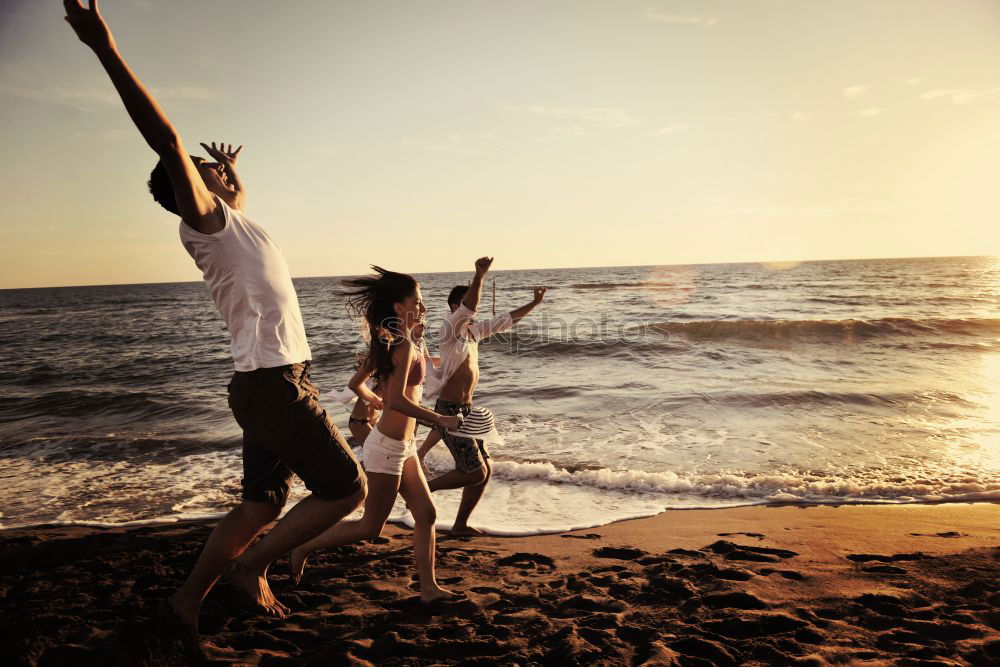 Similar – Father and son playing on the beach at the sunset time. Concept of friendly family.