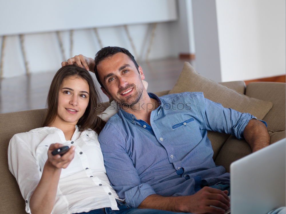 Similar – Image, Stock Photo Young couple reading book on couch at home