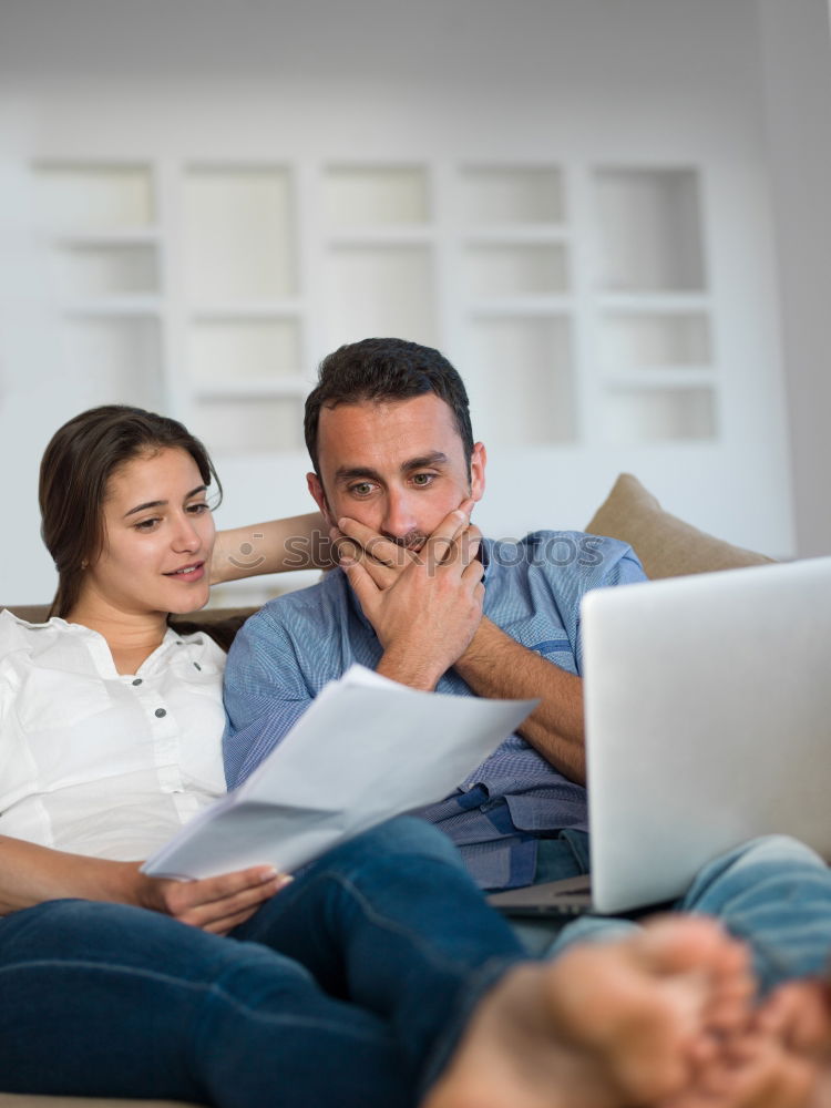 Similar – Image, Stock Photo Young couple reading book on couch at home