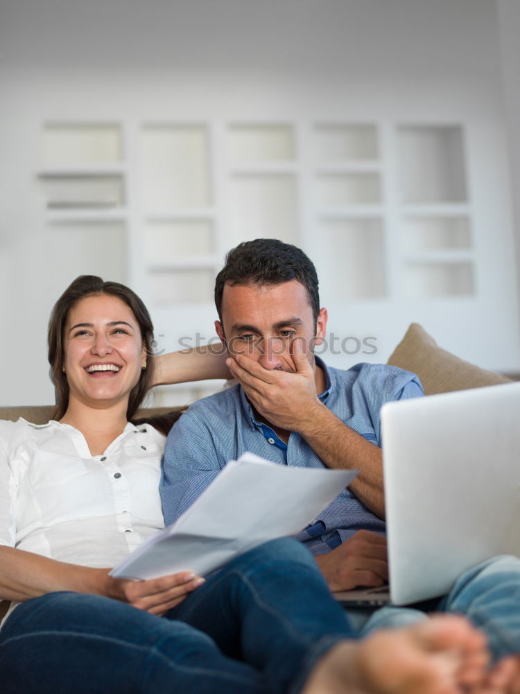 Similar – Image, Stock Photo Young couple reading book on couch at home