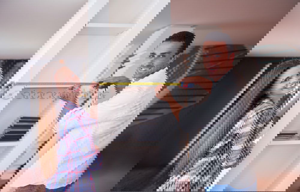 Image, Stock Photo Interracial couple painting a wardrobe