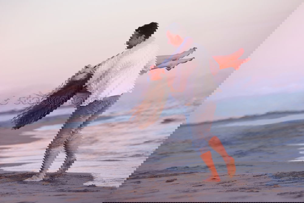Similar – Image, Stock Photo Father and son playing on the beach at the sunset time.