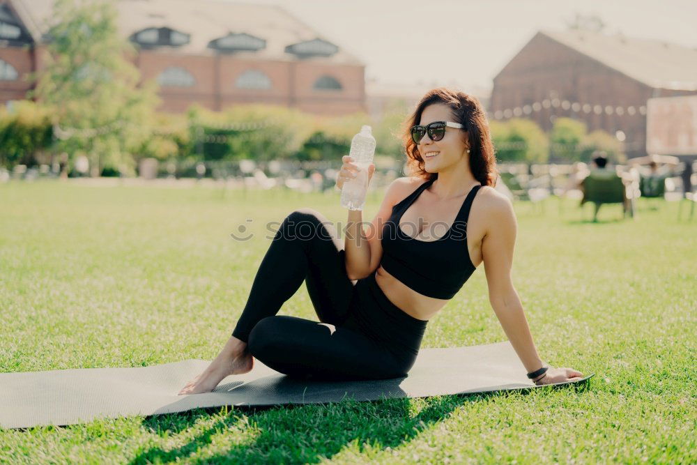 Similar – Image, Stock Photo Happy fit young woman does stretching workout on fitness mat practices yoga outside dressed in activewear has strong body breathes fresh air outdoor leads active lifestyle. Sport fitness concept