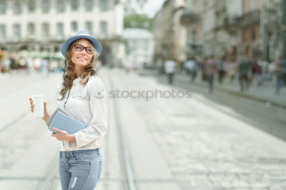 A young woman listening music on digital tablet sitting