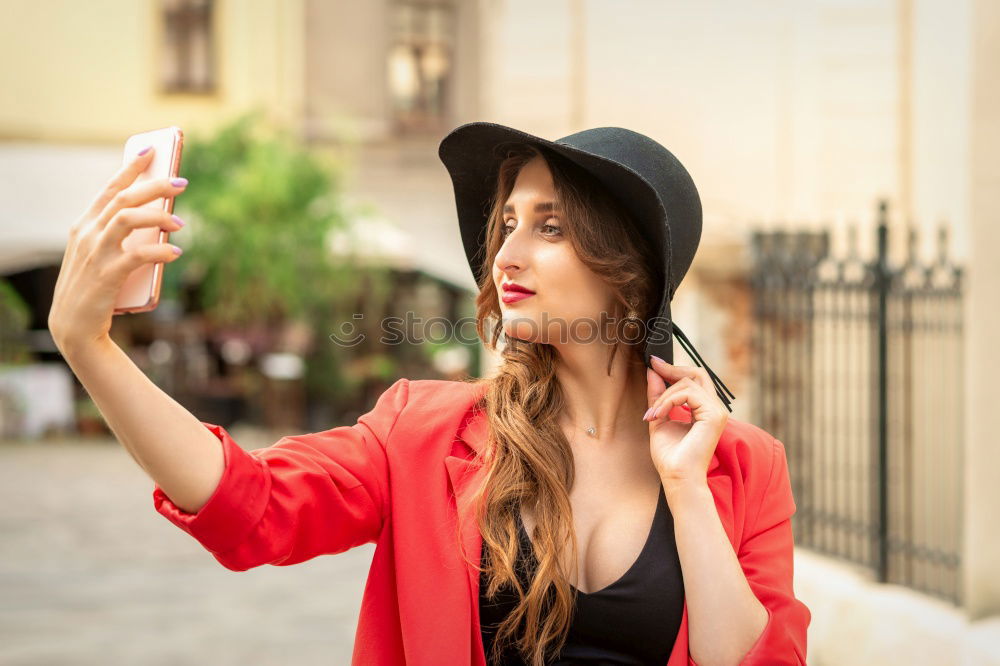 Similar – Cheerful friends taking photos of themselves on smart phone