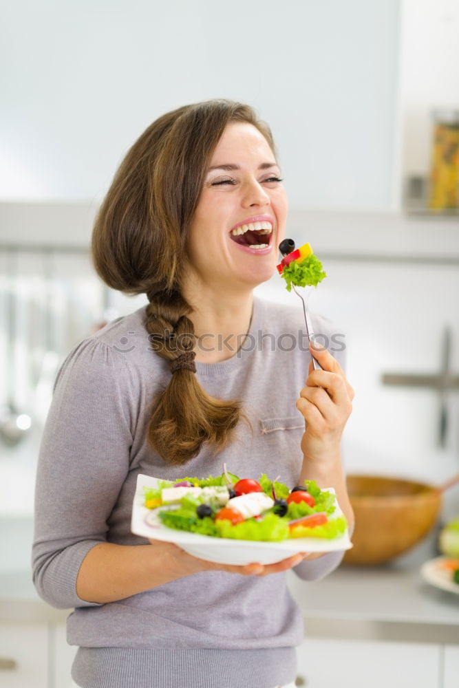 Crop woman eating sushi