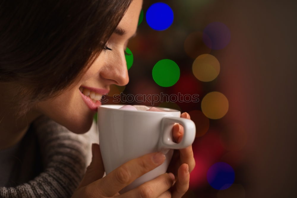 Similar – Young woman holding warm cup of tea