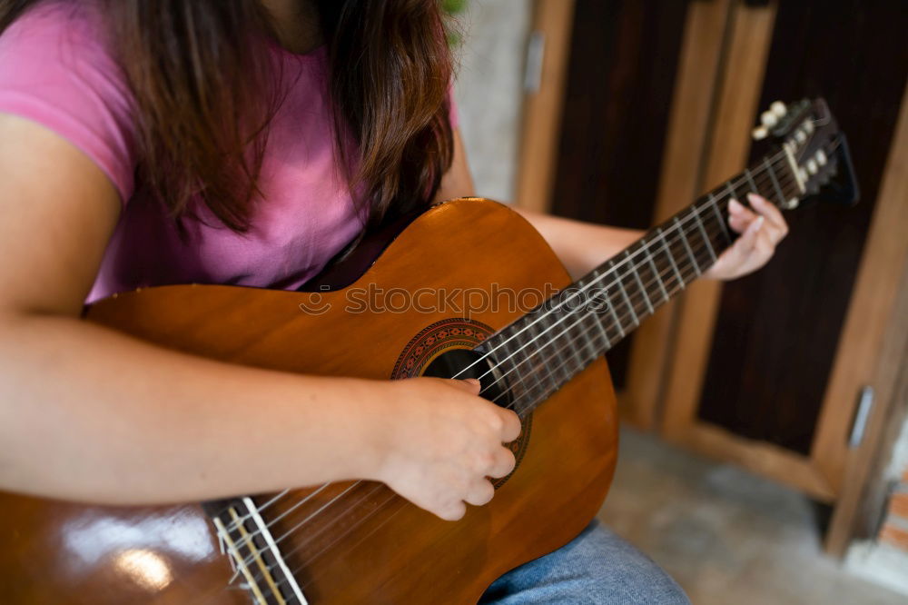 Similar – Image, Stock Photo Vibration | Guitar Pages II Young Woman Playing Guitar