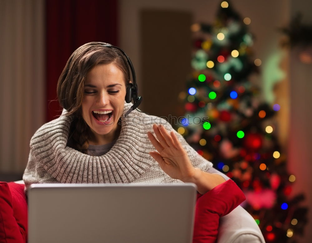 Similar – A happy couple with a child is celebrating Christmas with their friends on video call using webcam. Family greeting their relatives on Christmas eve online. New normal