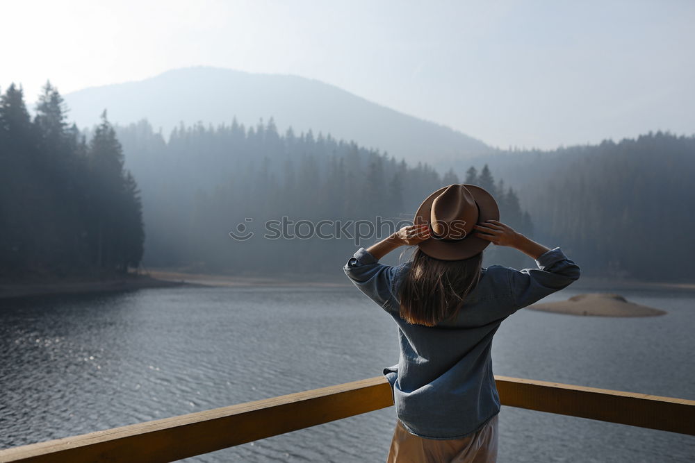 Similar – Image, Stock Photo Woman sitting on stone at lake