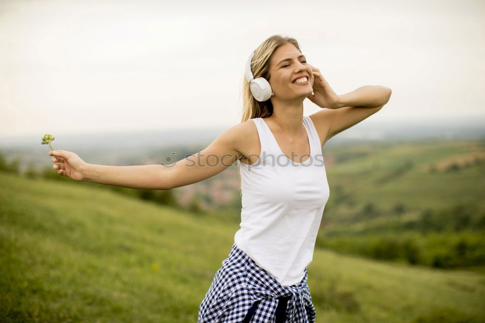 Similar – Image, Stock Photo Cheerful woman in bright light on nature