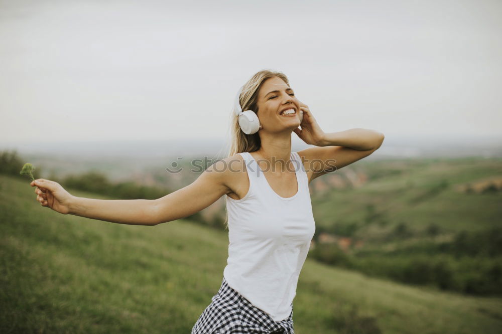 Similar – Image, Stock Photo Cheerful woman in bright light on nature