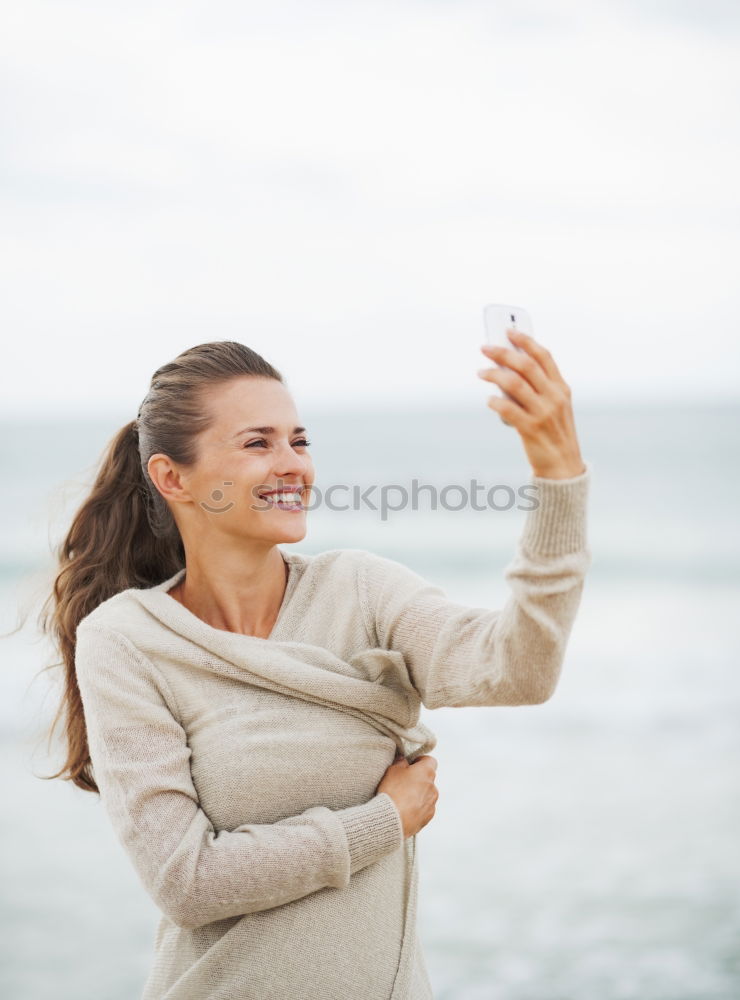 Similar – Image, Stock Photo Beautiful woman with sports clothes, sitting on a concrete wall outdoors at sunset.