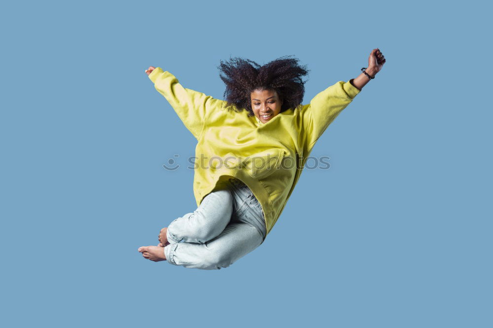 Similar – Woman with afro hair climbing by children’s attractions.