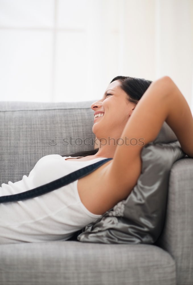 Similar – Image, Stock Photo Smiling woman lying on table