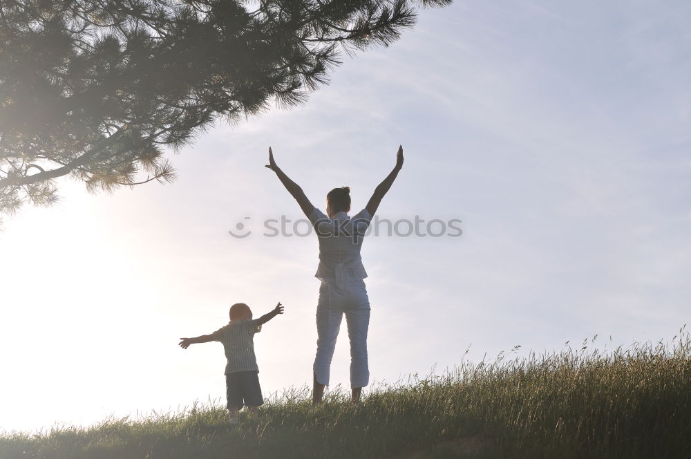 Similar – Father and daughter playing on the beach at the day time.