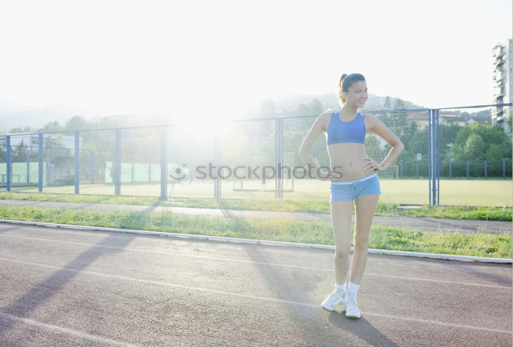 Similar – athletic woman doing her stretching routine