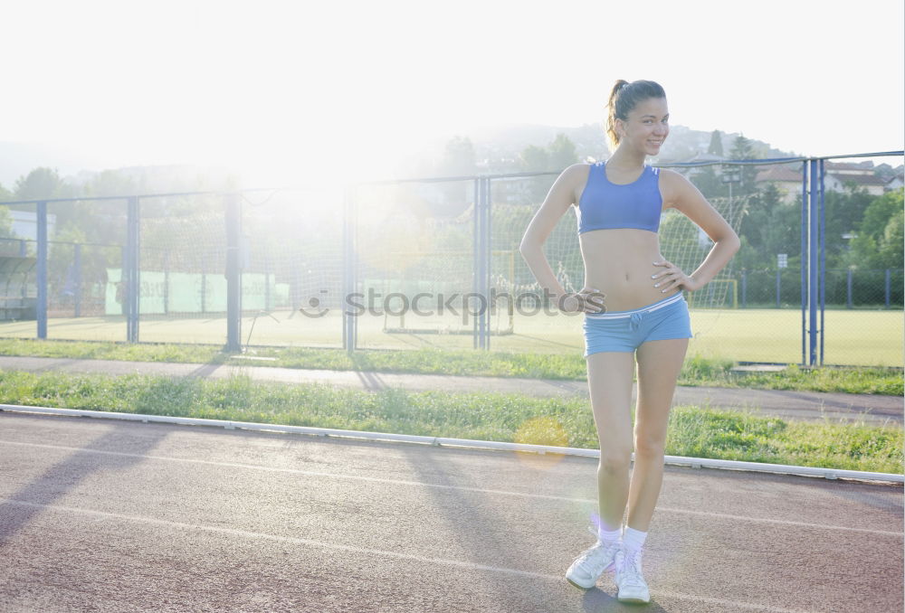 Similar – athletic woman doing her stretching routine