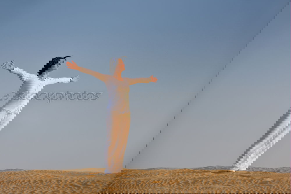Similar – Image, Stock Photo Athletic man balancing on hands on embankment
