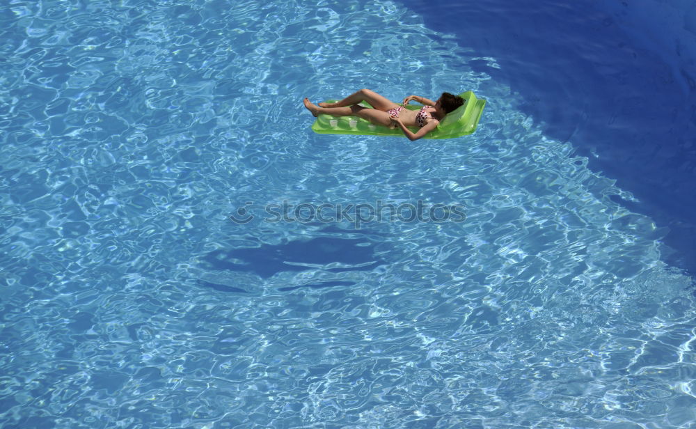 Similar – Underwater shot of a swimming man