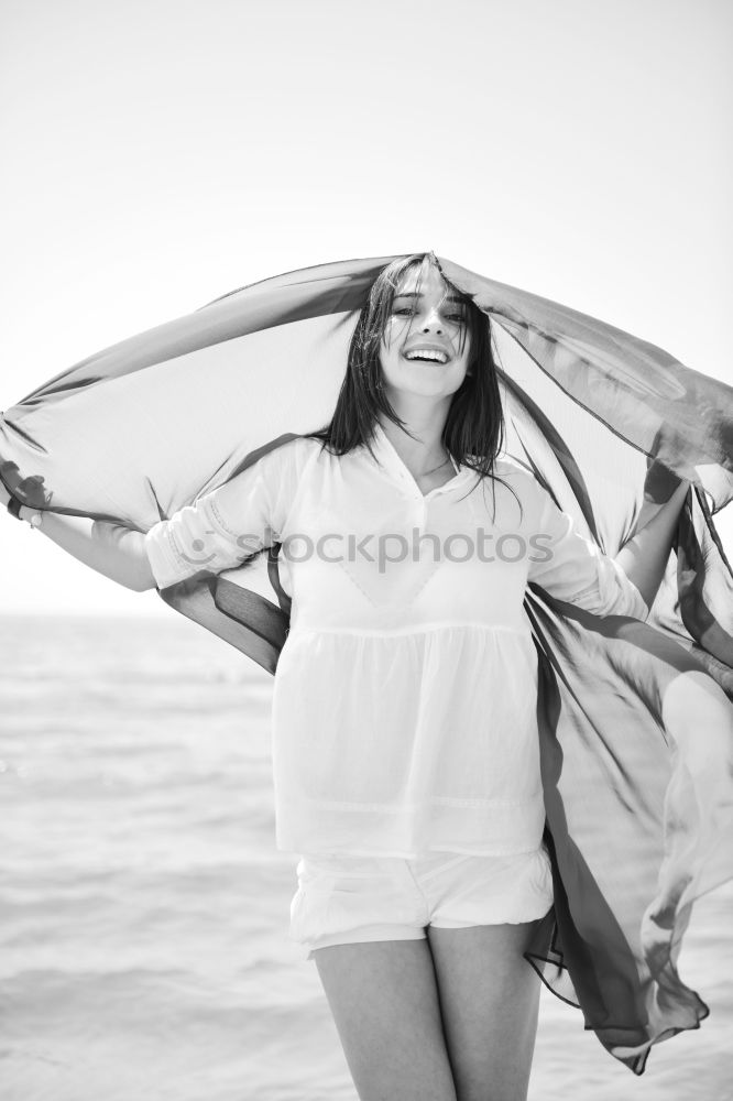 Similar – Image, Stock Photo Young adult couple kissing on beach after running workout