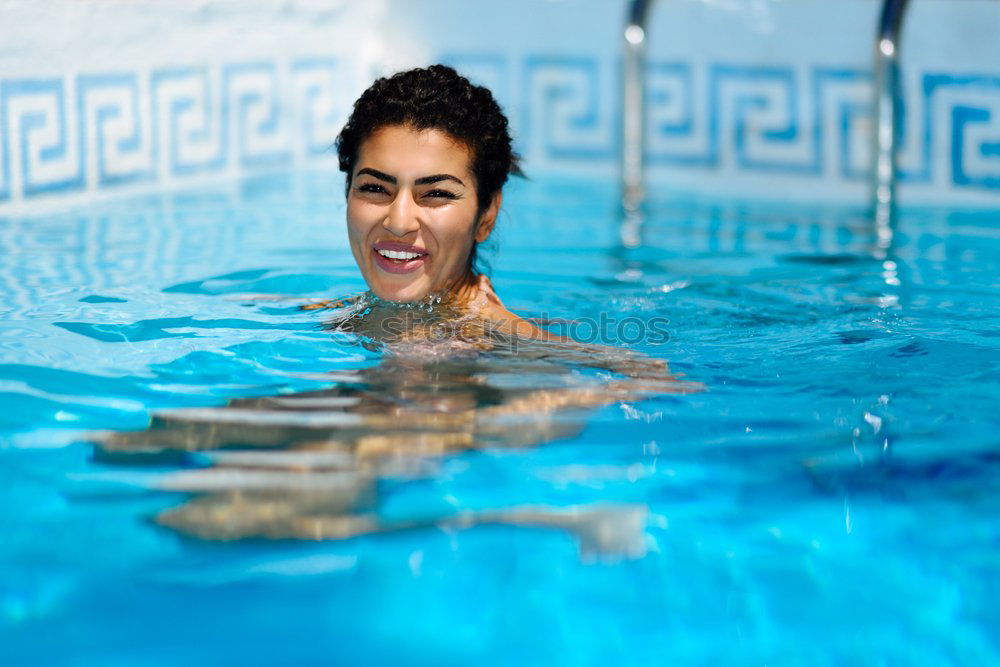 Image, Stock Photo Happy young woman relaxing in swimming pool.