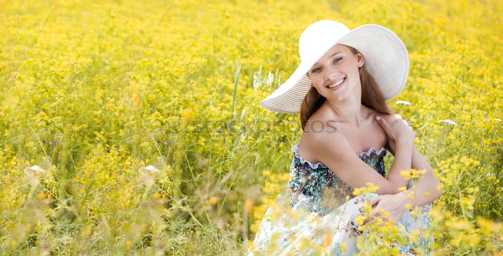 Similar – Image, Stock Photo Happy summer love woman sitting smiling in canola field. Attractive young beauty girl enjoying the warm sunny sun in nature, taking time to feel sustainability, reflection and youthful well-being.