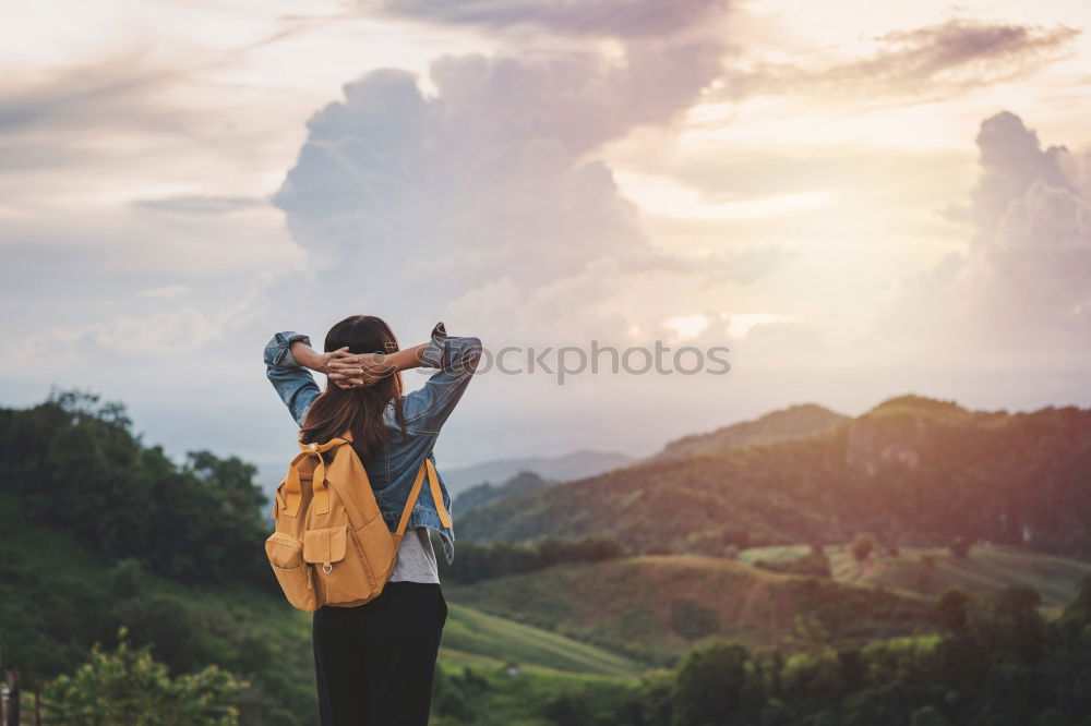 Similar – Cyclist drinking water on the bike at sunset. Sports