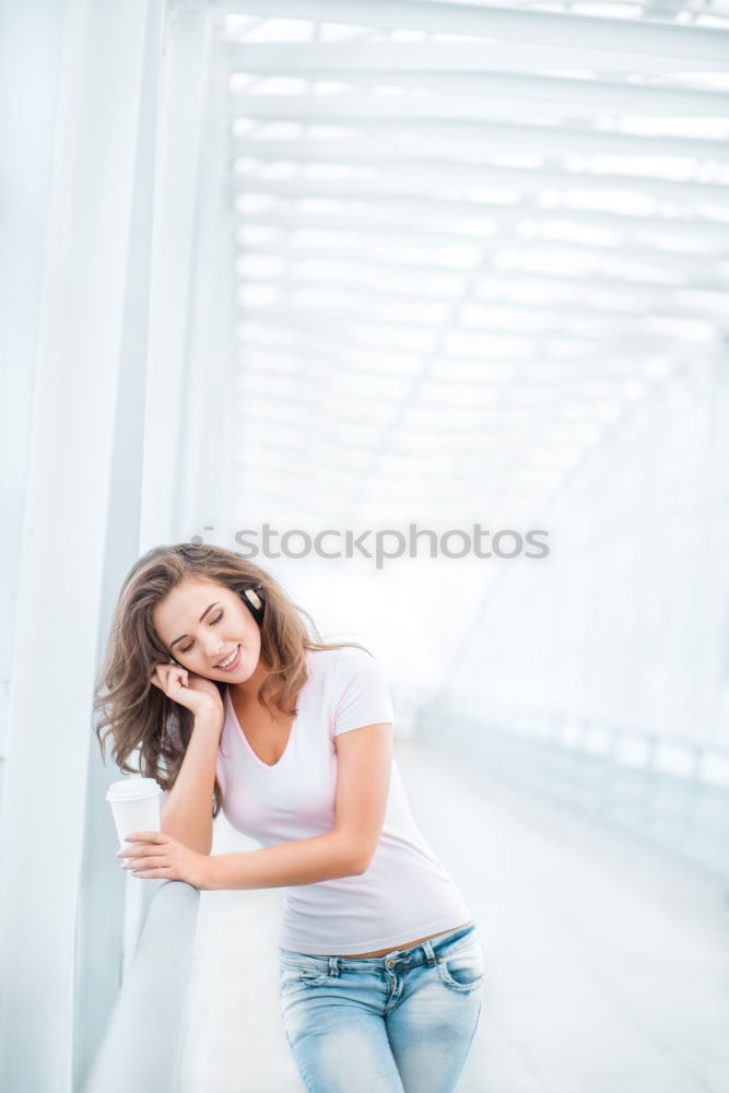 Similar – Woman sitting outdoors putting her hand near the camera.