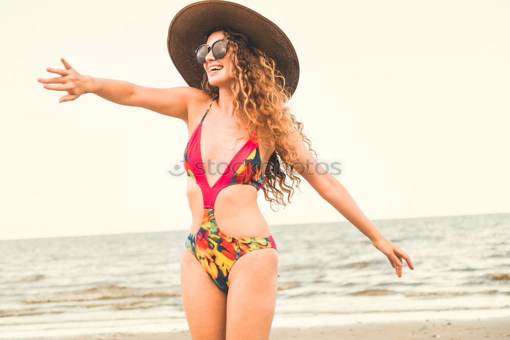 Similar – Image, Stock Photo Beautiful young woman wearing a bikini in a wooden foot bridge at the beach