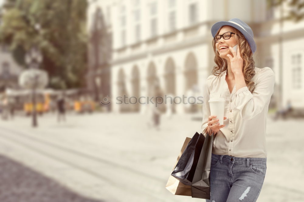 Similar – Image, Stock Photo Fashionable woman holding her mobile