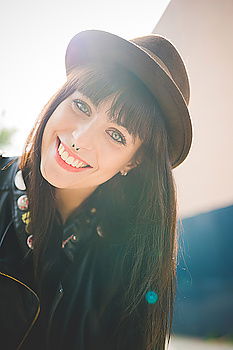 Similar – Woman with a hat for graffiti laughs with closed eyes