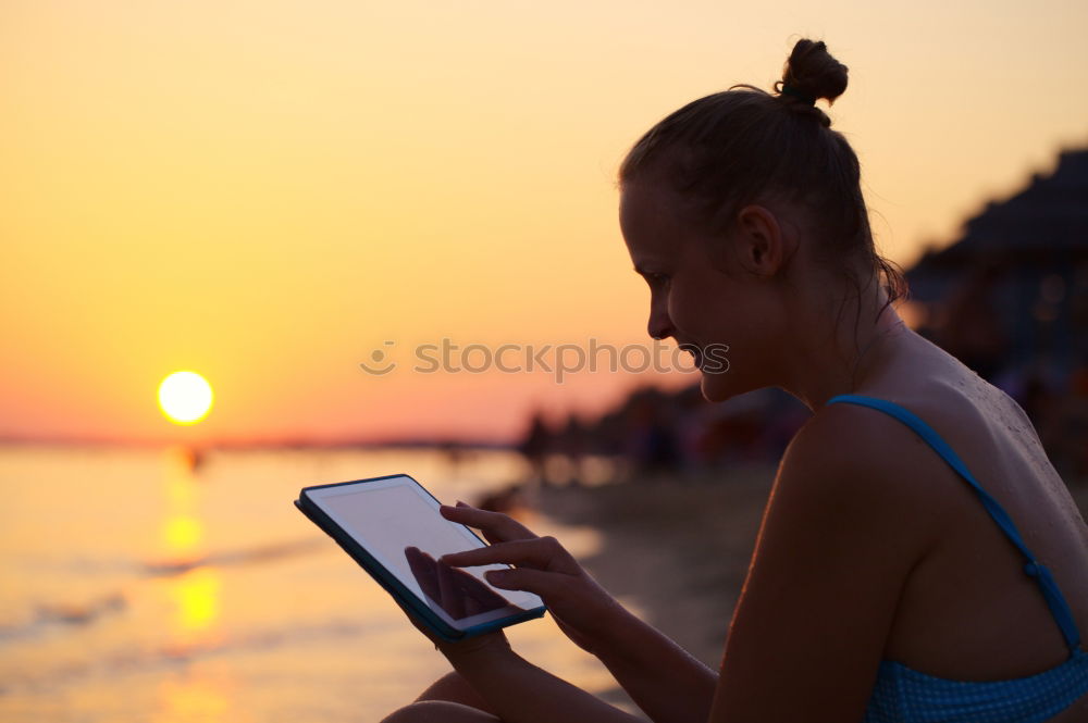 Similar – Image, Stock Photo Close-up shot ofwoman working with tablet computer on sunset and sea background