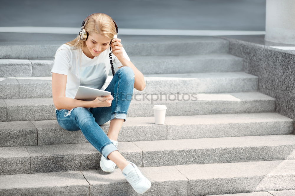 Similar – Attractive teenager sitting on steps in town