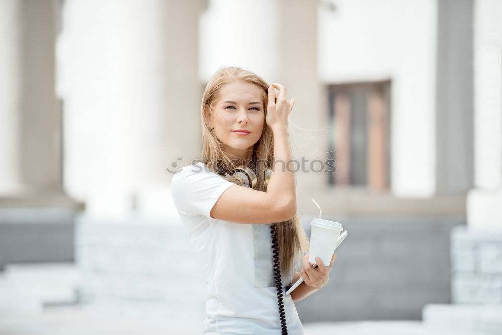 Similar – Beautiful young caucasian woman smiling outdoors