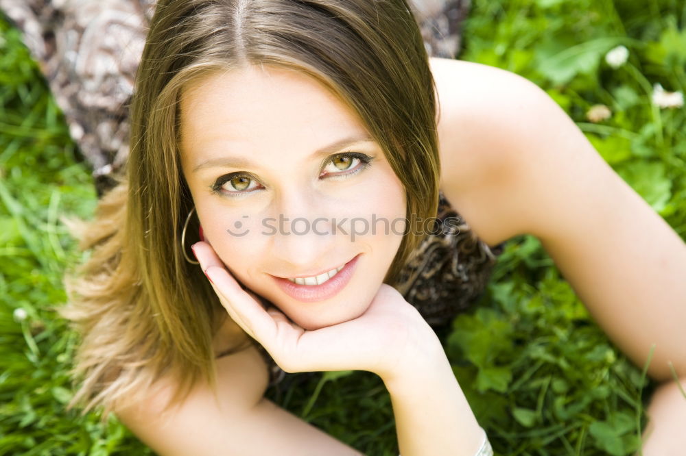 Similar – Young woman with freckles sits on a high flat roof in the evening light and smiles at the camera