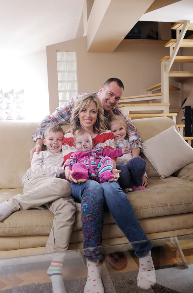 Similar – Mature couple relaxed at home in bed with their four little daughters and the Dog