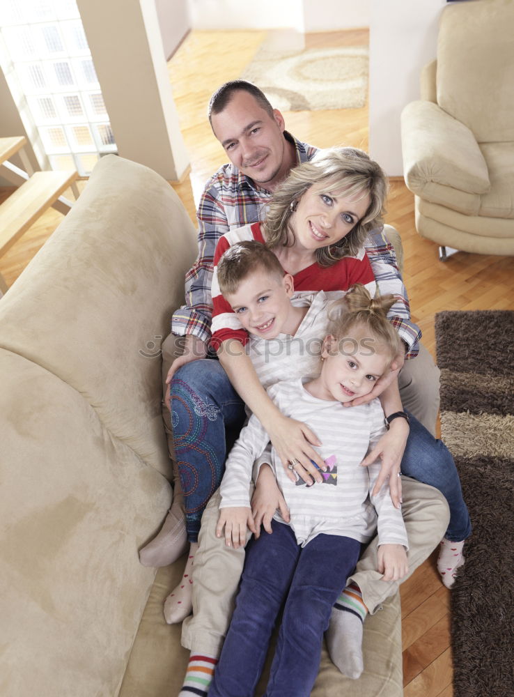 Similar – Mature couple relaxed at home in bed with their four little daughters and the Dog