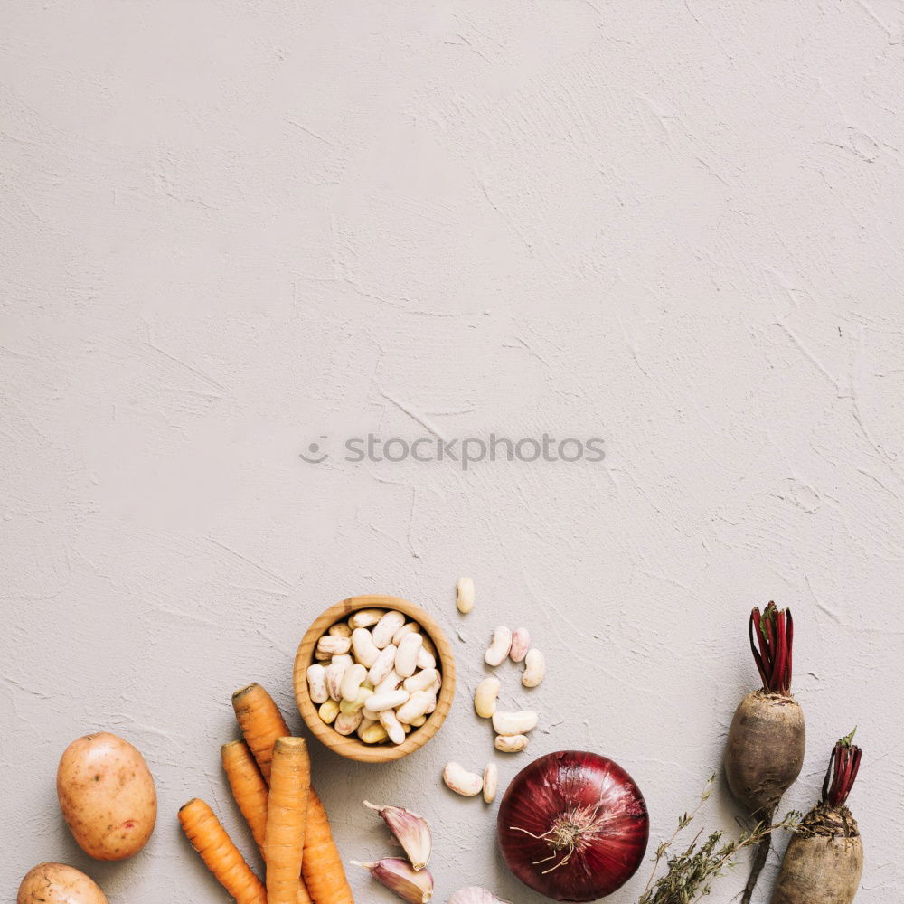 Similar – process of slicing fresh carrots on a chopping board