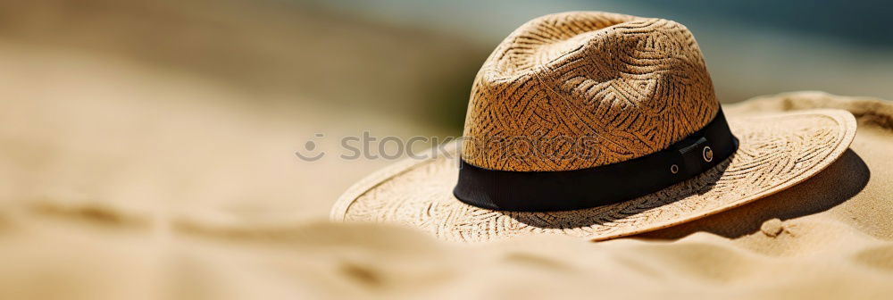 Similar – Straw hat on sand Sand Hat