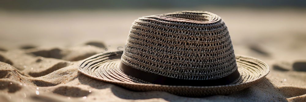 Similar – Straw hat on sand Sand Hat