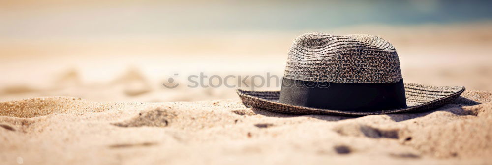 Similar – Straw hat on sand Sand Hat