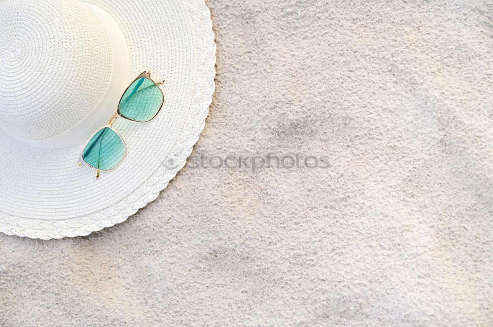 Similar – Summer woman accessories with shells and tropical leaves on pastel color background, top view. Straw hat, sunglasses, sandals and handbag. Holiday vacation. Female fashion outfit