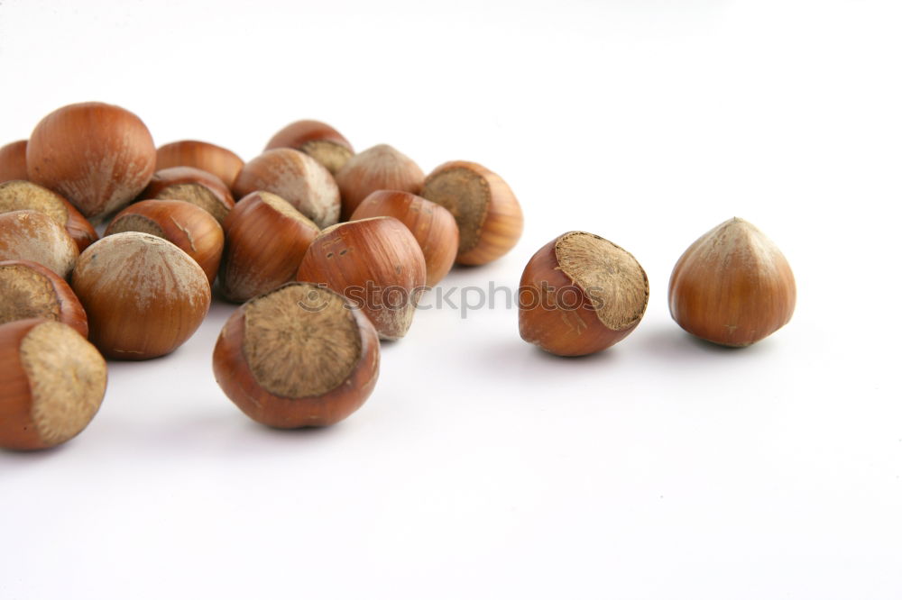 Similar – Image, Stock Photo Hazelnuts on a wooden table in a row