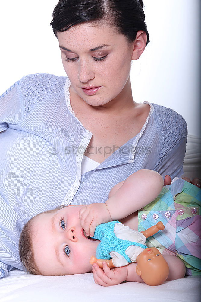 Similar – Image, Stock Photo Close-up of mother breastfeeding her little baby on the patio