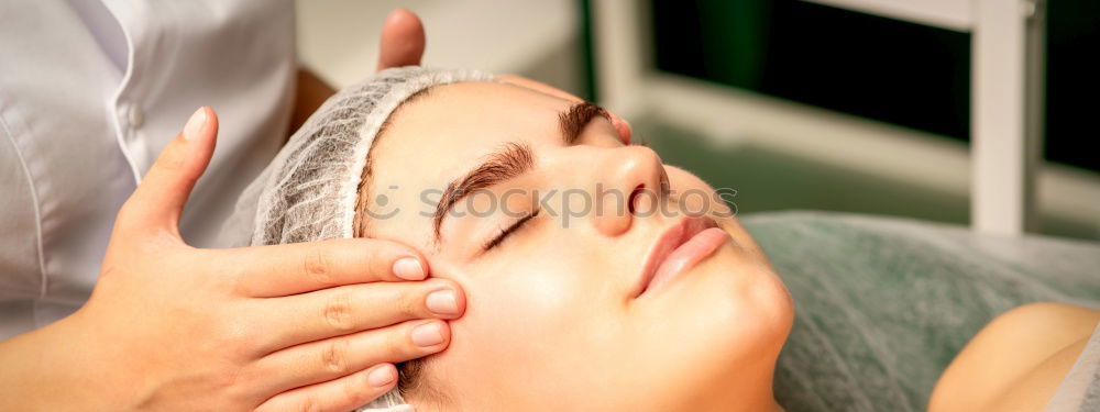 Similar – Massage therapist doing lymphatic drainage treatment to woman