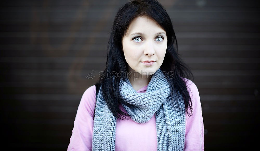 Stylish Pretty Woman Leaning on a red brick pillar