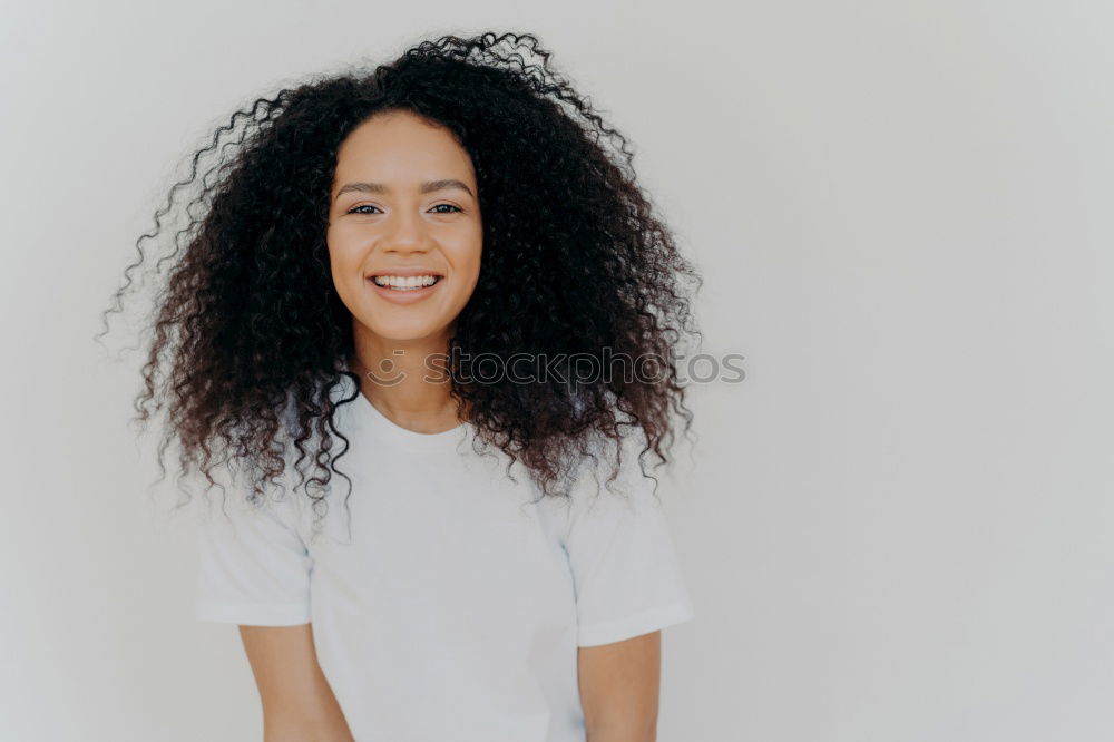 Similar – close up of a pretty black woman with curly hair smiling and lying on bed looking away