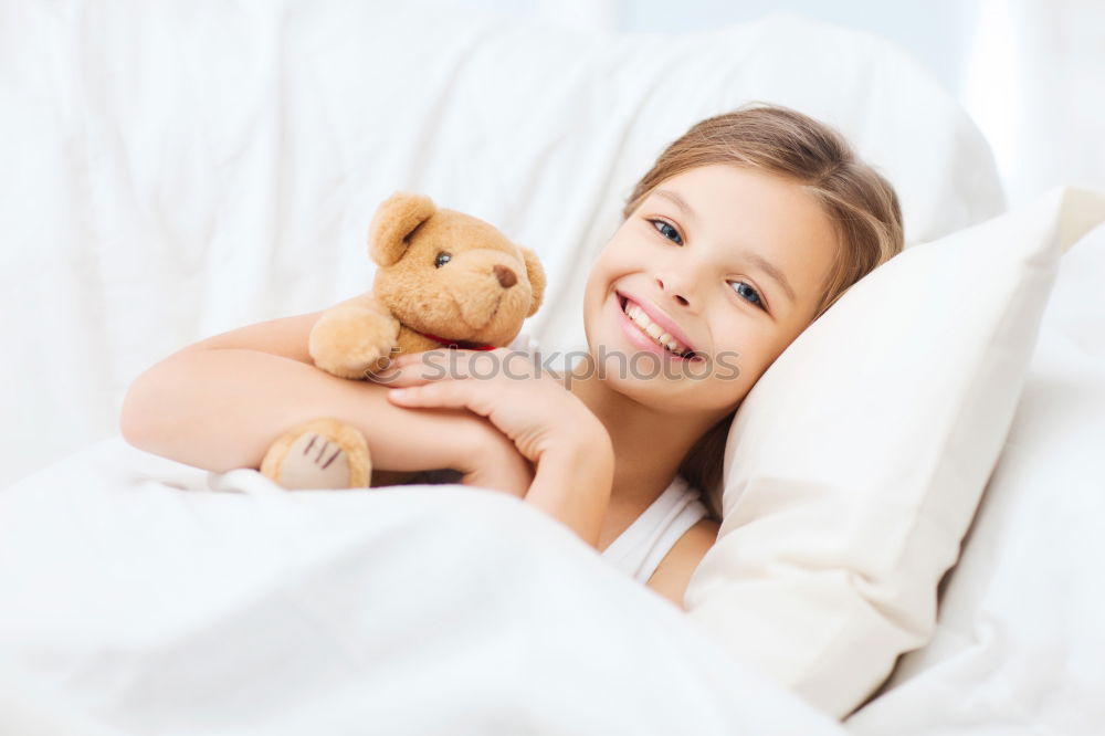 Similar – cute happy child girl relaxing at home on the bed